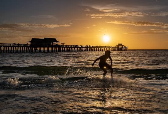 naples beach pier at sunset